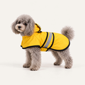 Adjustable Waterproof Dog Raincoat worn by a dog on a warm neutral studio background