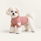 Heart Patch Dog Sweatshirt worn by a dog on a warm neutral studio background